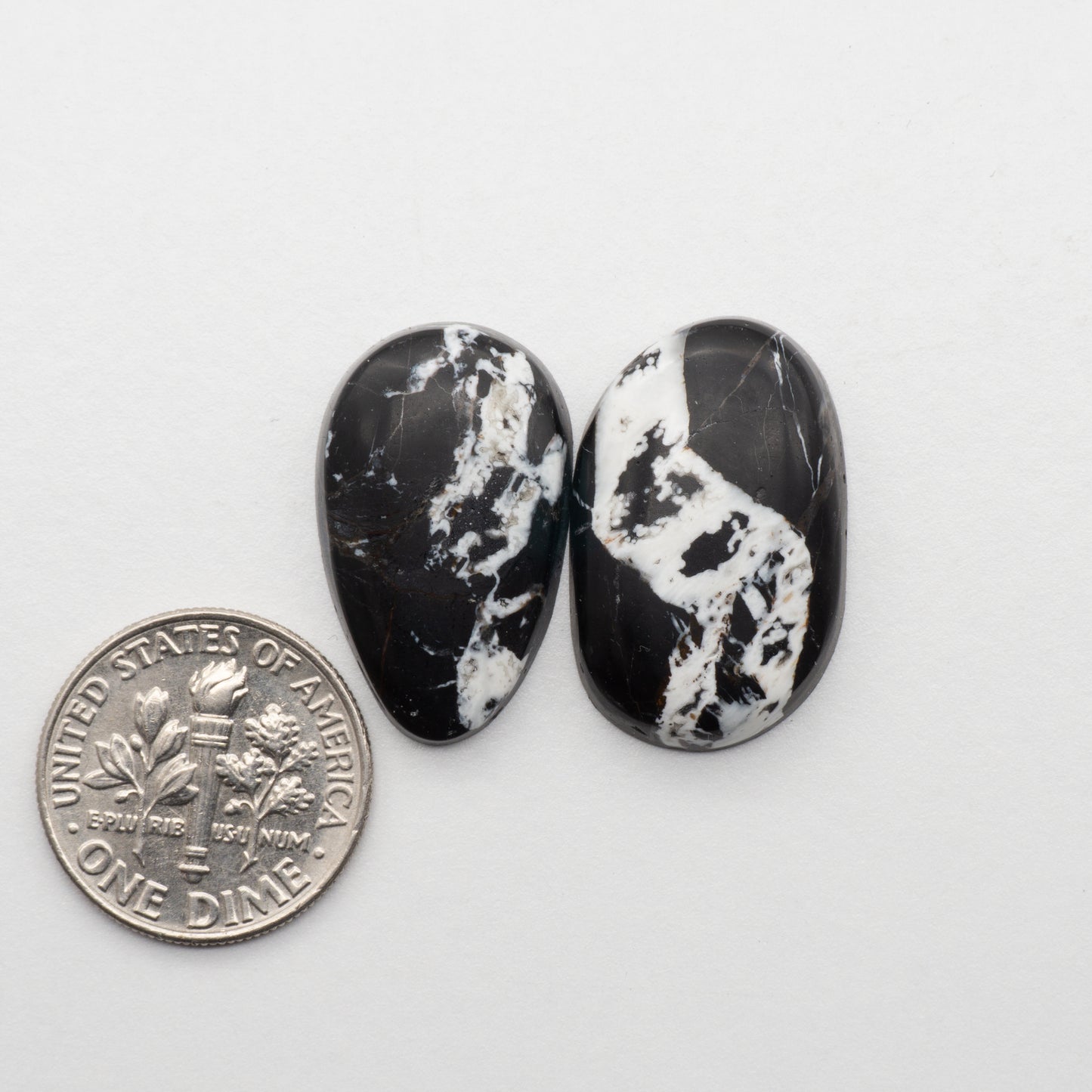 White Buffalo Stone Cabochons are semi-precious gemstones cut into shapes ideal for jewelry-making and crafting. The unique and varied veining of each cabochon lend an unparalleled depth and detail to any project, making them an excellent choice for artisans looking to add an individualistic touch.