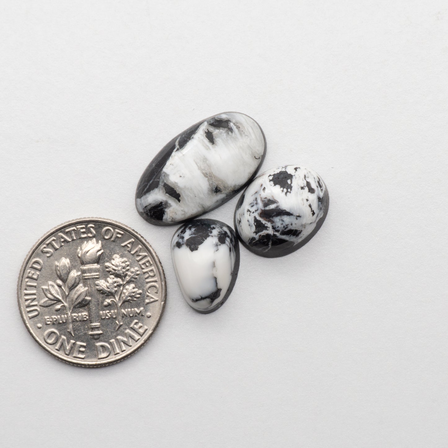White Buffalo Stone Cabochons are semi-precious gemstones cut into shapes ideal for jewelry-making and crafting. The unique and varied veining of each cabochon lend an unparalleled depth and detail to any project, making them an excellent choice for artisans looking to add an individualistic touch.