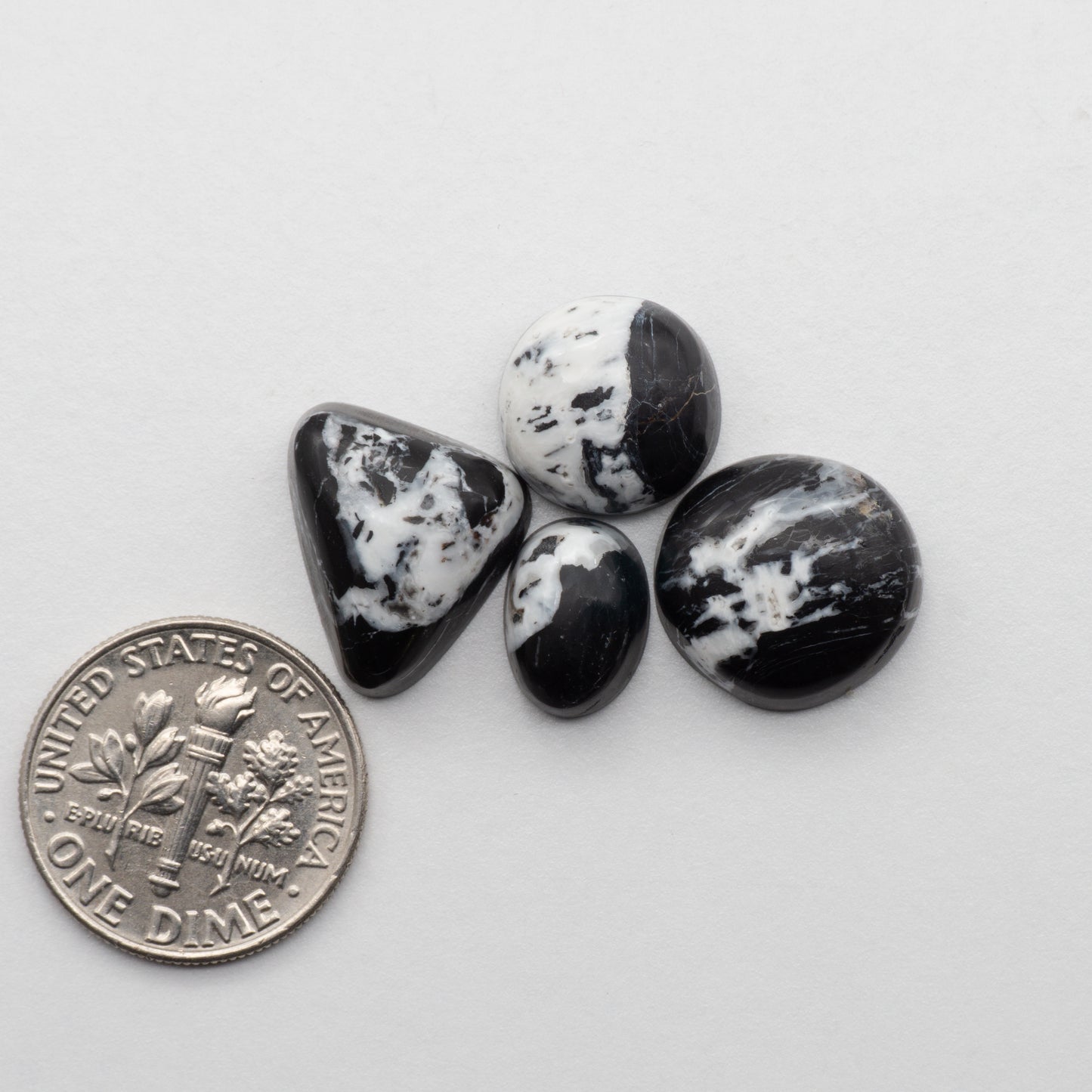 White Buffalo Stone Cabochons are semi-precious gemstones cut into shapes ideal for jewelry-making and crafting. The unique and varied veining of each cabochon lend an unparalleled depth and detail to any project, making them an excellent choice for artisans looking to add an individualistic touch.