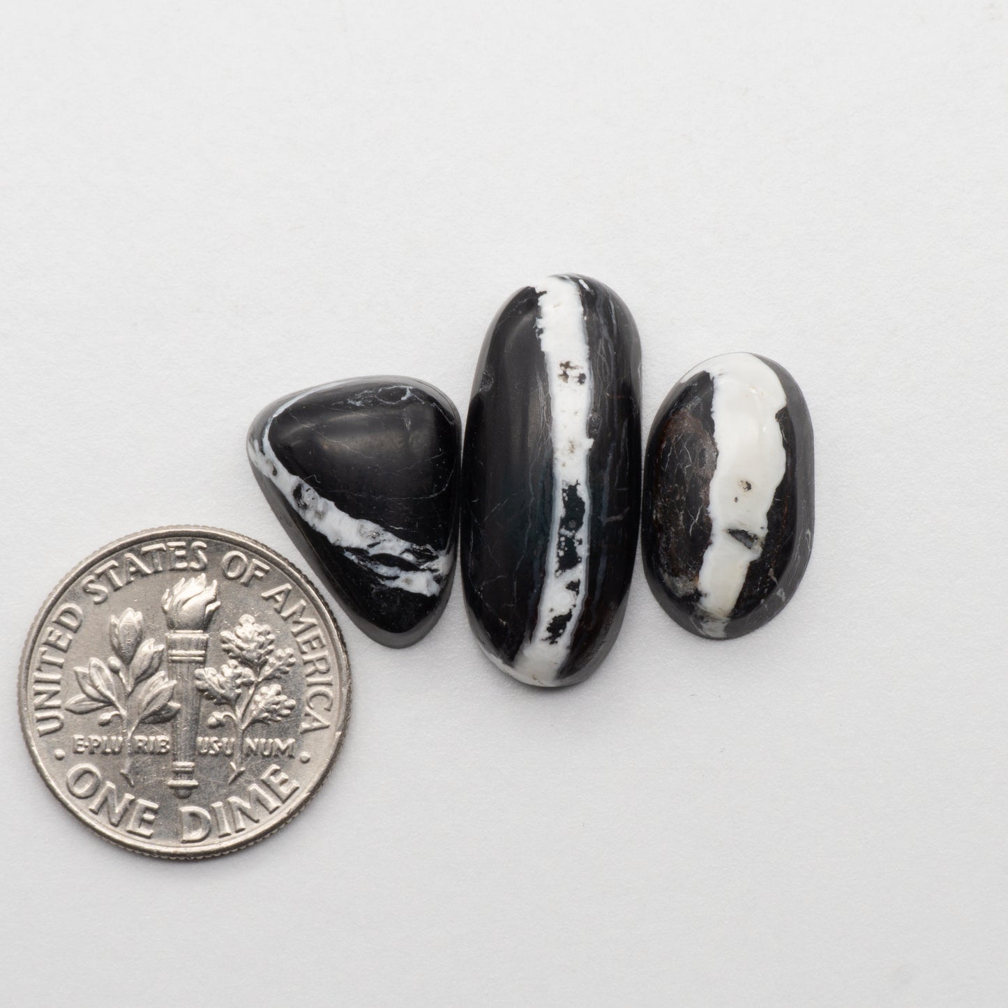 White Buffalo Stone Cabochons are semi-precious gemstones cut into shapes ideal for jewelry-making and crafting. The unique and varied veining of each cabochon lend an unparalleled depth and detail to any project, making them an excellent choice for artisans looking to add an individualistic touch.