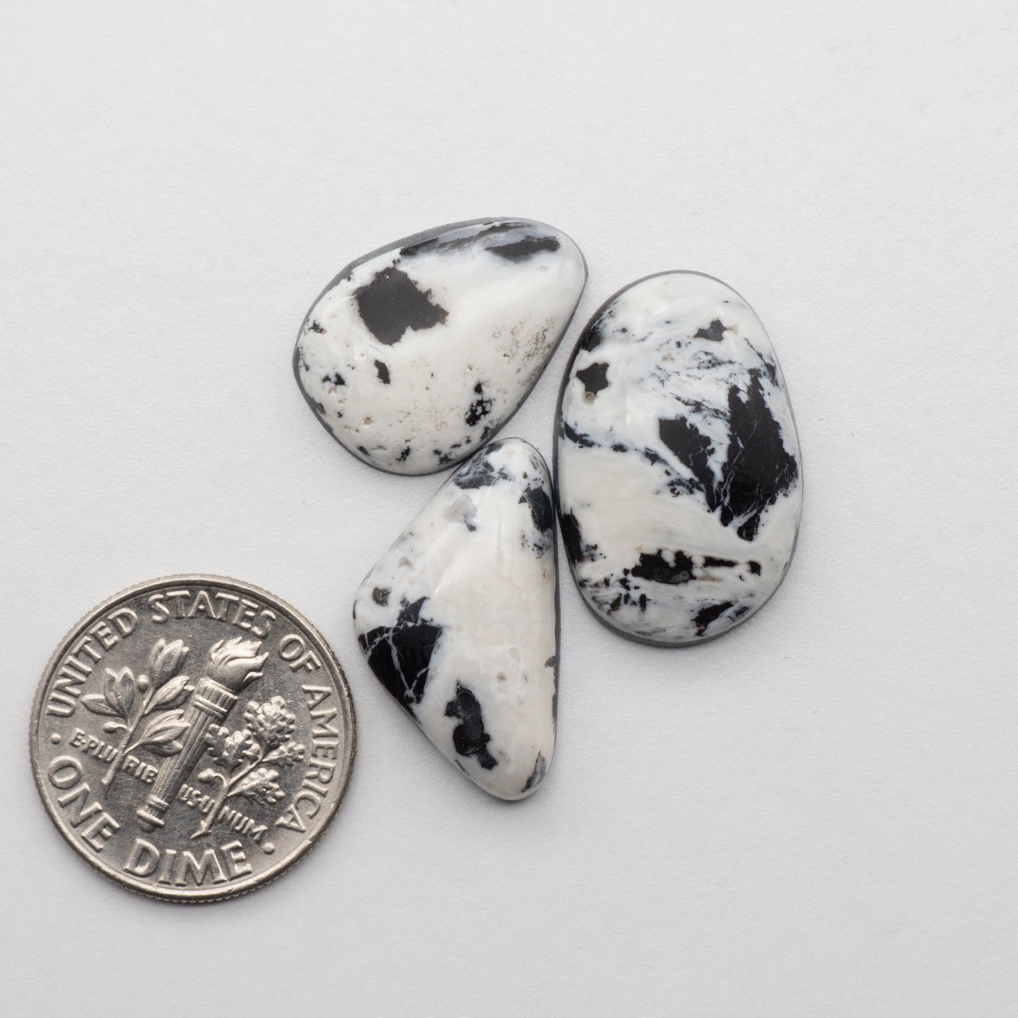 White Buffalo Stone Cabochons are semi-precious gemstones cut into shapes ideal for jewelry-making and crafting. The unique and varied veining of each cabochon lend an unparalleled depth and detail to any project, making them an excellent choice for artisans looking to add an individualistic touch.