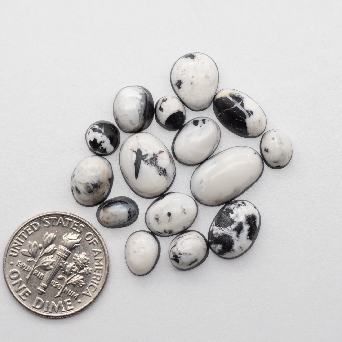 White Buffalo Stone Cabochons are semi-precious gemstones cut into shapes ideal for jewelry-making and crafting. The unique and varied veining of each cabochon lend an unparalleled depth and detail to any project, making them an excellent choice for artisans looking to add an individualistic touch.
