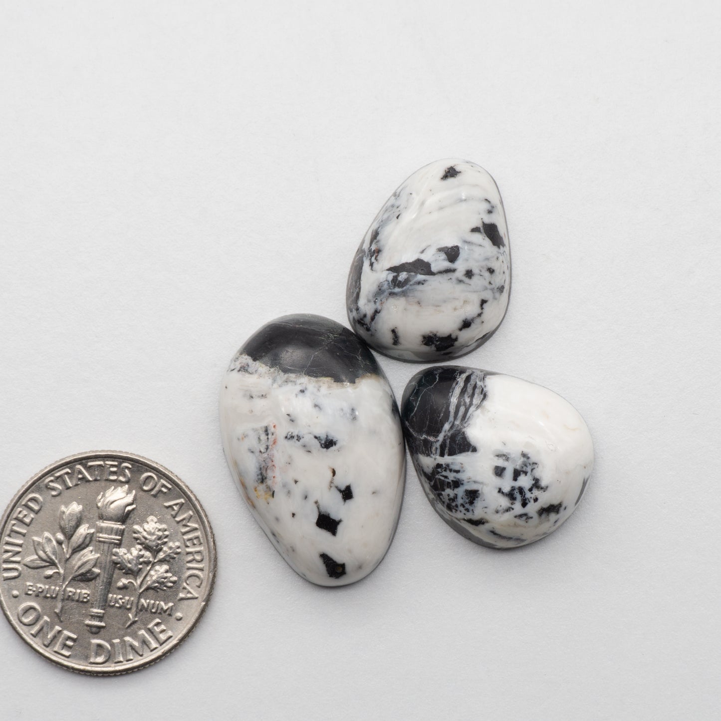 White Buffalo Stone Cabochons are semi-precious gemstones cut into shapes ideal for jewelry-making and crafting. The unique and varied veining of each cabochon lend an unparalleled depth and detail to any project, making them an excellent choice for artisans looking to add an individualistic touch.