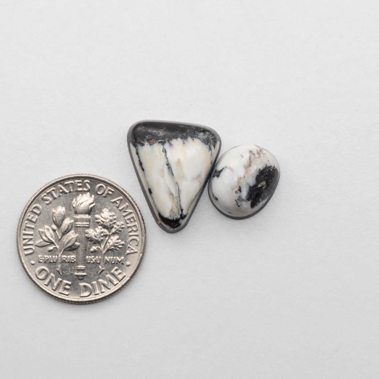 White Buffalo Stone Cabochons are semi-precious gemstones cut into shapes ideal for jewelry-making and crafting. The unique and varied veining of each cabochon lend an unparalleled depth and detail to any project, making them an excellent choice for artisans looking to add an individualistic touch.