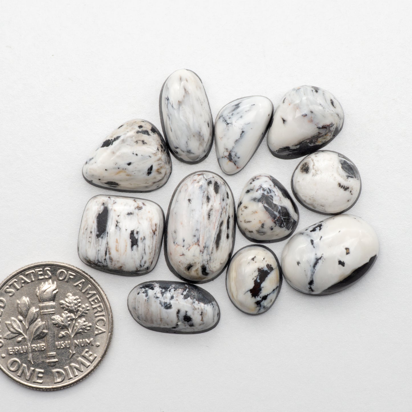 White Buffalo Stone Cabochons are semi-precious gemstones cut into shapes ideal for jewelry-making and crafting. The unique and varied veining of each cabochon lend an unparalleled depth and detail to any project, making them an excellent choice for artisans looking to add an individualistic touch.
