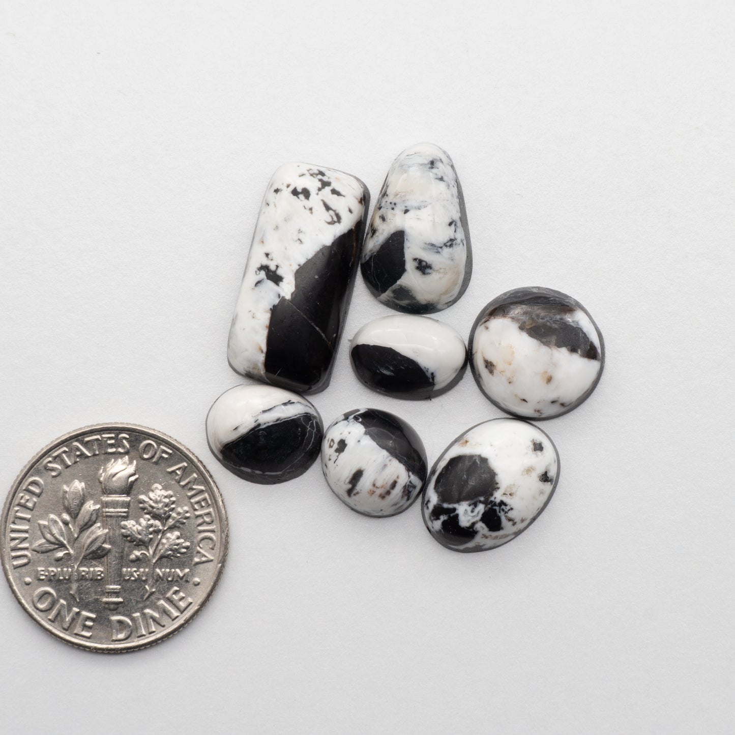 White Buffalo Stone Cabochons are semi-precious gemstones cut into shapes ideal for jewelry-making and crafting. The unique and varied veining of each cabochon lend an unparalleled depth and detail to any project, making them an excellent choice for artisans looking to add an individualistic touch.