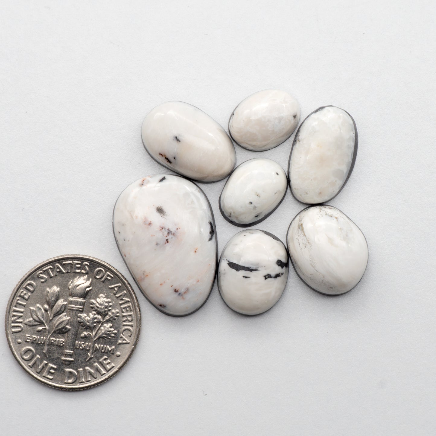 White Buffalo Stone Cabochons are semi-precious gemstones cut into shapes ideal for jewelry-making and crafting. The unique and varied veining of each cabochon lend an unparalleled depth and detail to any project, making them an excellent choice for artisans looking to add an individualistic touch.