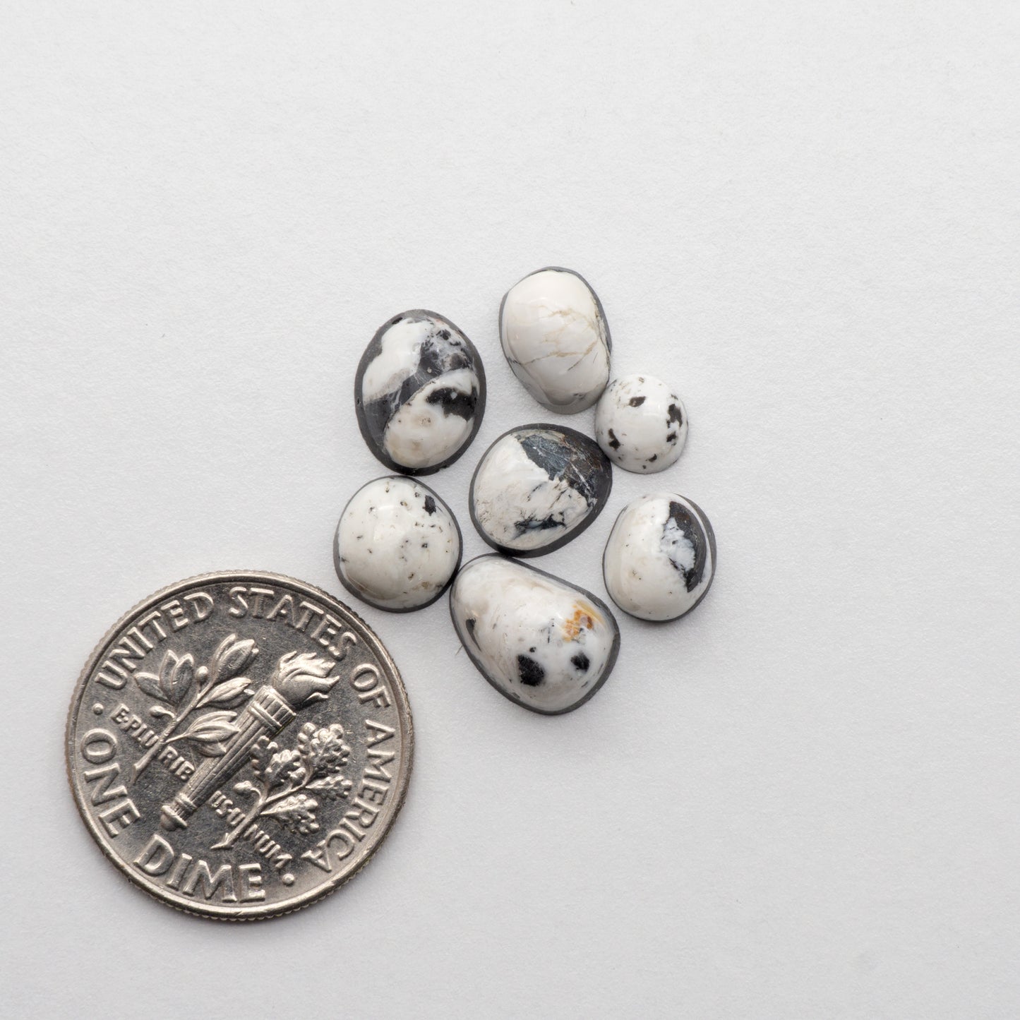 White Buffalo Stone Cabochons are semi-precious gemstones cut into shapes ideal for jewelry-making and crafting. The unique and varied veining of each cabochon lend an unparalleled depth and detail to any project, making them an excellent choice for artisans looking to add an individualistic touch.