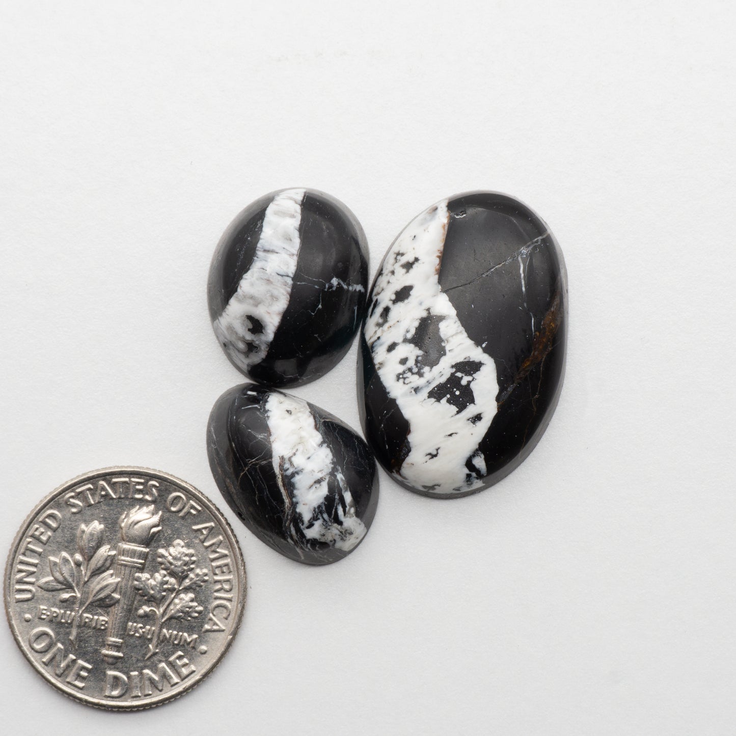 White Buffalo Stone Cabochons are semi-precious gemstones cut into shapes ideal for jewelry-making and crafting. The unique and varied veining of each cabochon lend an unparalleled depth and detail to any project, making them an excellent choice for artisans looking to add an individualistic touch.