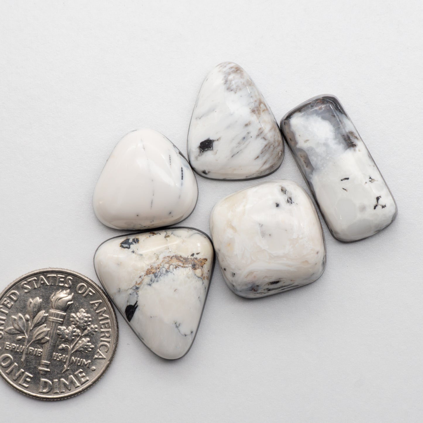 White Buffalo Stone Cabochons are semi-precious gemstones cut into shapes ideal for jewelry-making and crafting. The unique and varied veining of each cabochon lend an unparalleled depth and detail to any project, making them an excellent choice for artisans looking to add an individualistic touch.