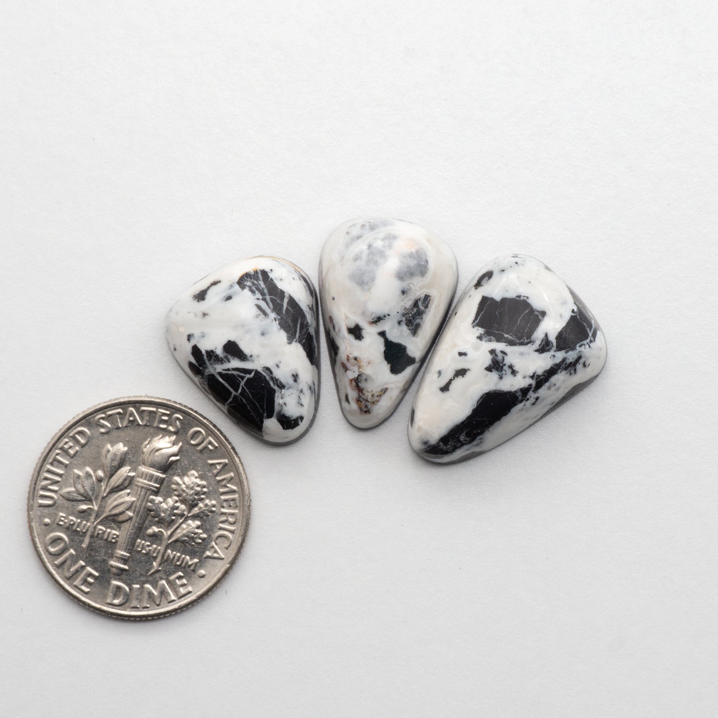 White Buffalo Stone Cabochons are semi-precious gemstones cut into shapes ideal for jewelry-making and crafting. The unique and varied veining of each cabochon lend an unparalleled depth and detail to any project, making them an excellent choice for artisans looking to add an individualistic touch.