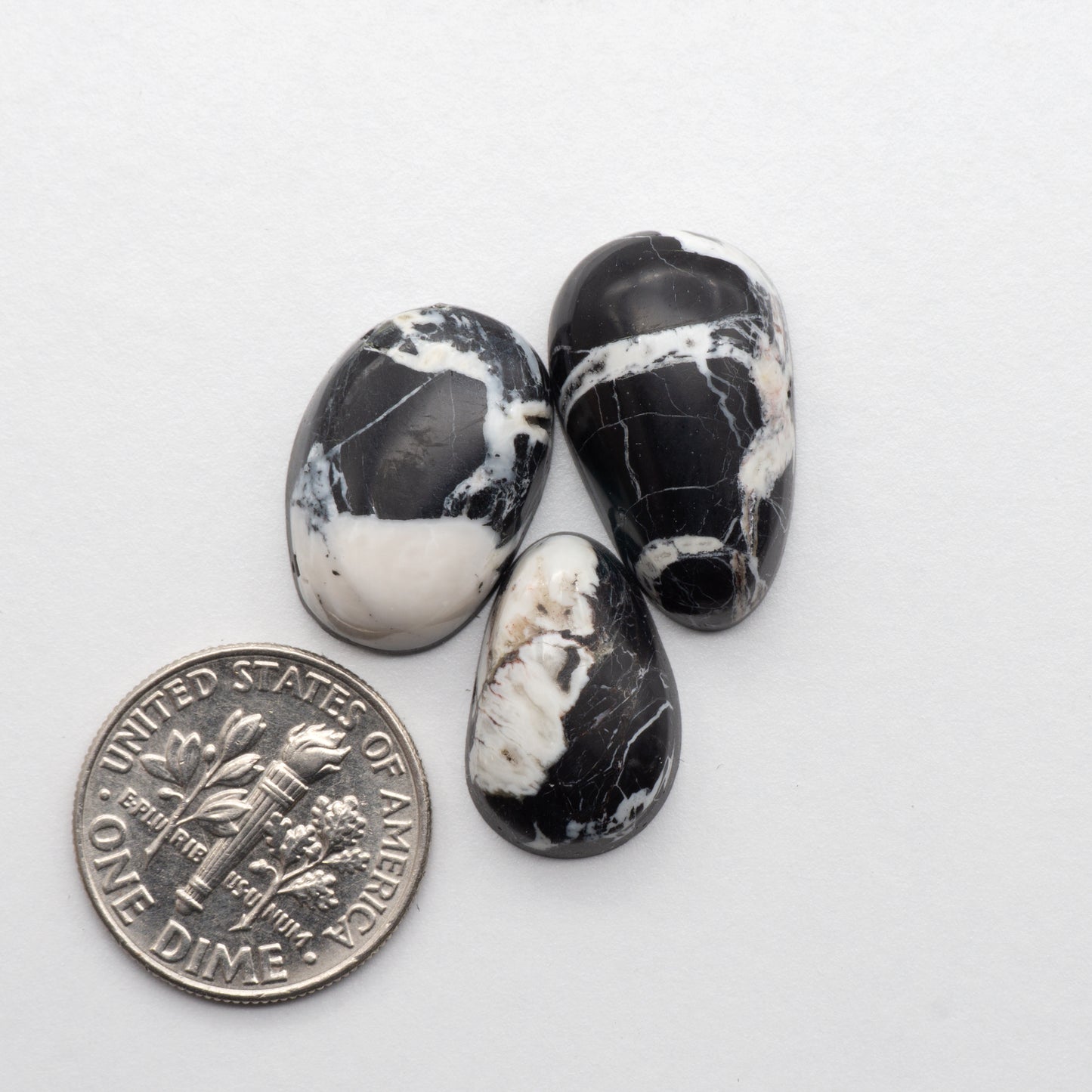 White Buffalo Stone Cabochons are semi-precious gemstones cut into shapes ideal for jewelry-making and crafting. The unique and varied veining of each cabochon lend an unparalleled depth and detail to any project, making them an excellent choice for artisans looking to add an individualistic touch.