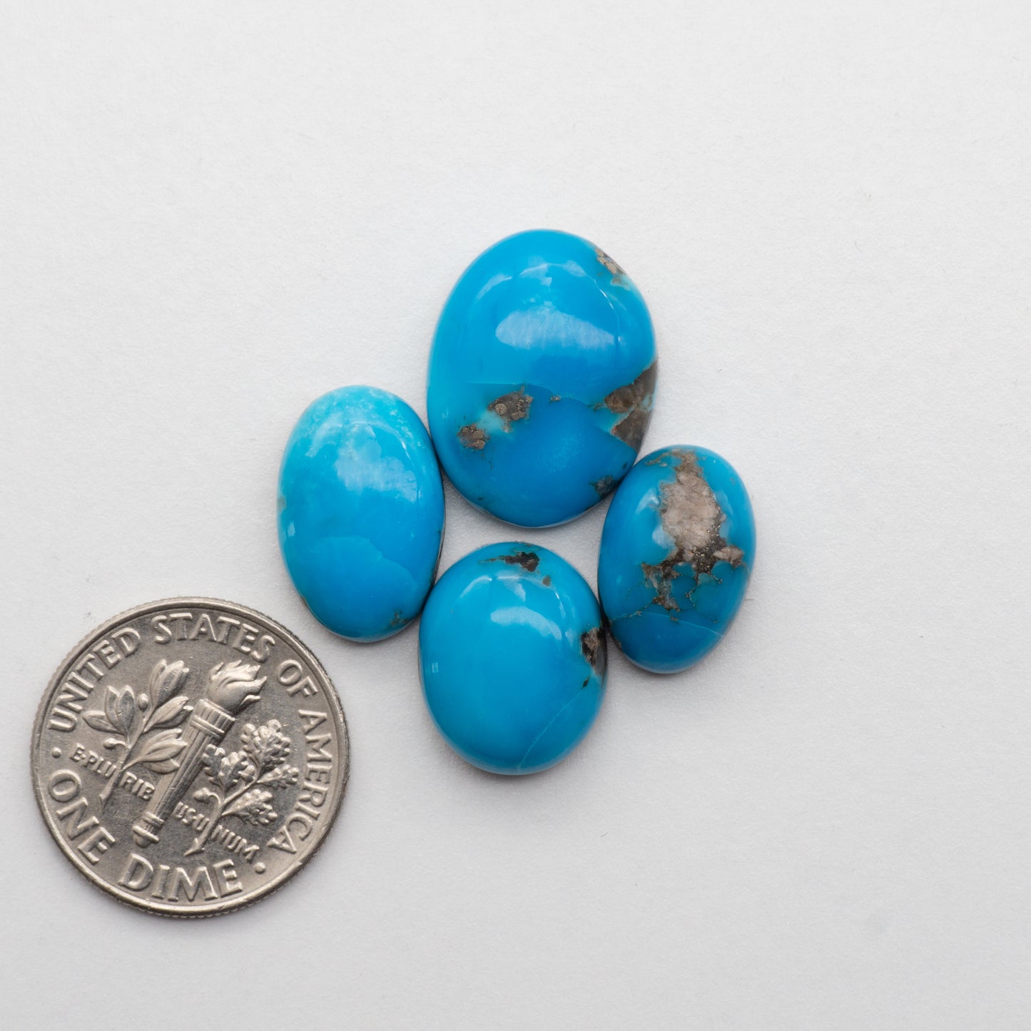 Add unique splashes of color to your jewelry with our Kingman Turquoise Cabochons. Featuring natural blue hues, these cabochons offer a beautiful contrast to any design. Perfect for necklaces, earrings, and more!