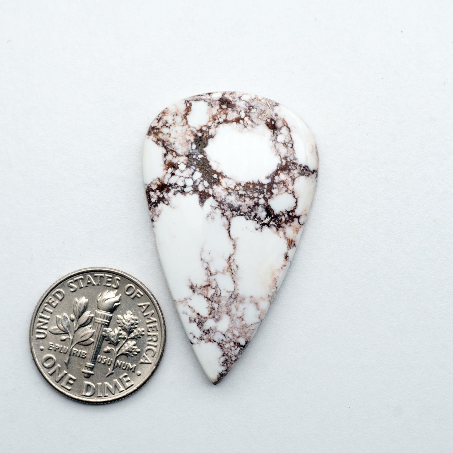 This Natural Wild Horse Cabochon has a glossy finish and is unbacked. This Magnesite stone is mined in Arizona, USA and is similar to turquoise used for jewelry making.