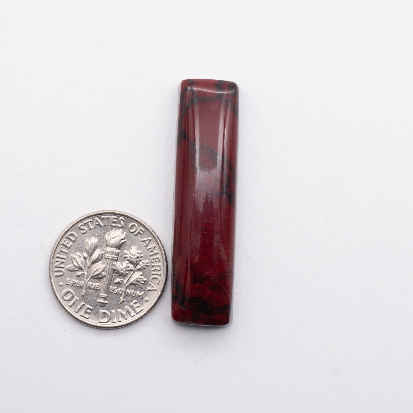 Introducing Bloody Bison Jasper - an exquisite stone with a deep, red hue that makes a bold statement. Its truestone construction ensures a piece of fine quality and lasting durability, while its unique coloring provides an opulent touch to any piece of jewerly. Cabochon is backed for added strength.