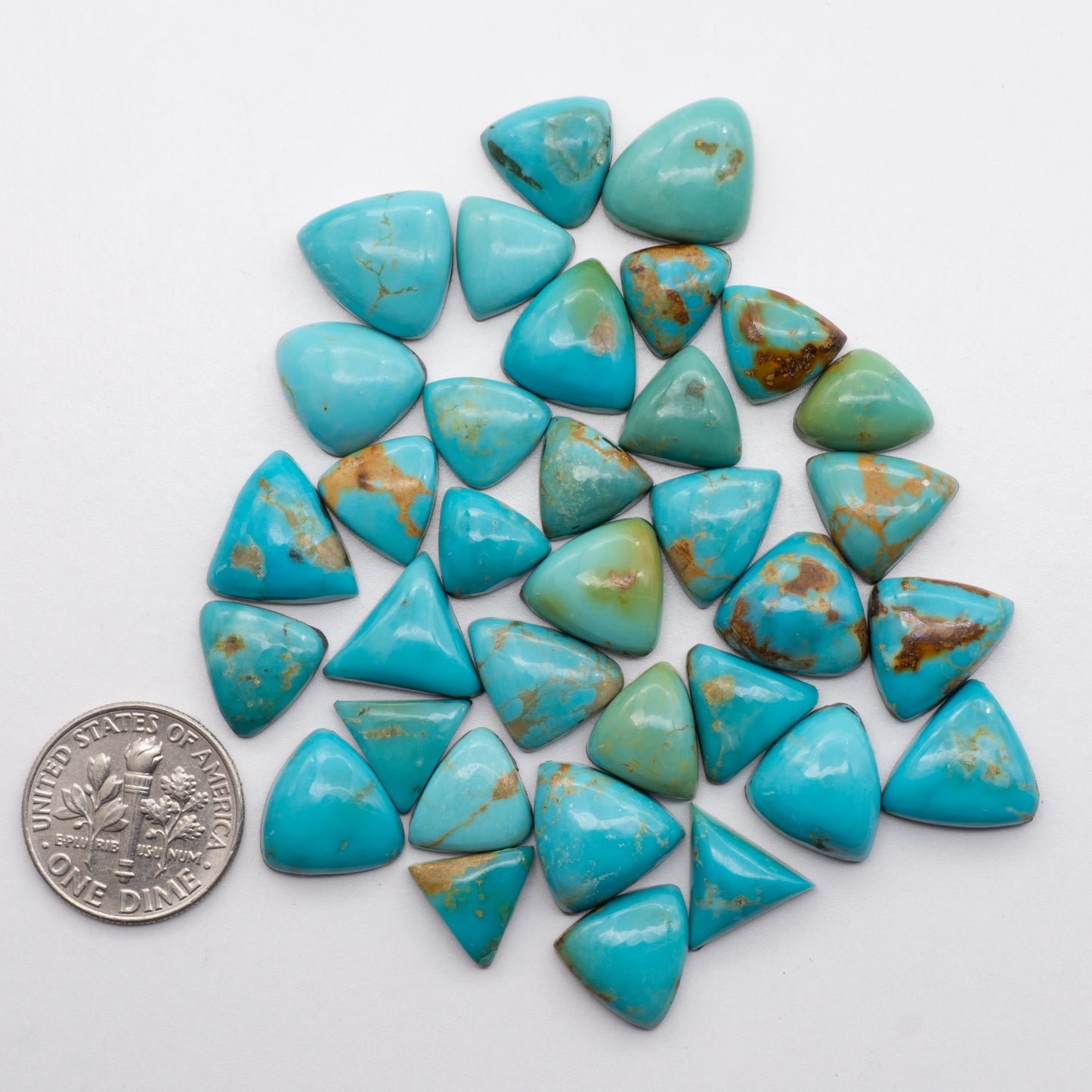 Blue Gem Turquoise is a beautiful blue-green gemstone that's perfect for jewelry or decoration. It has a unique and attractive coloration, and is naturally found in hues of light blue and blue-green. These cabochons are backed for added strength, making it a great choice for high-quality jewelry.