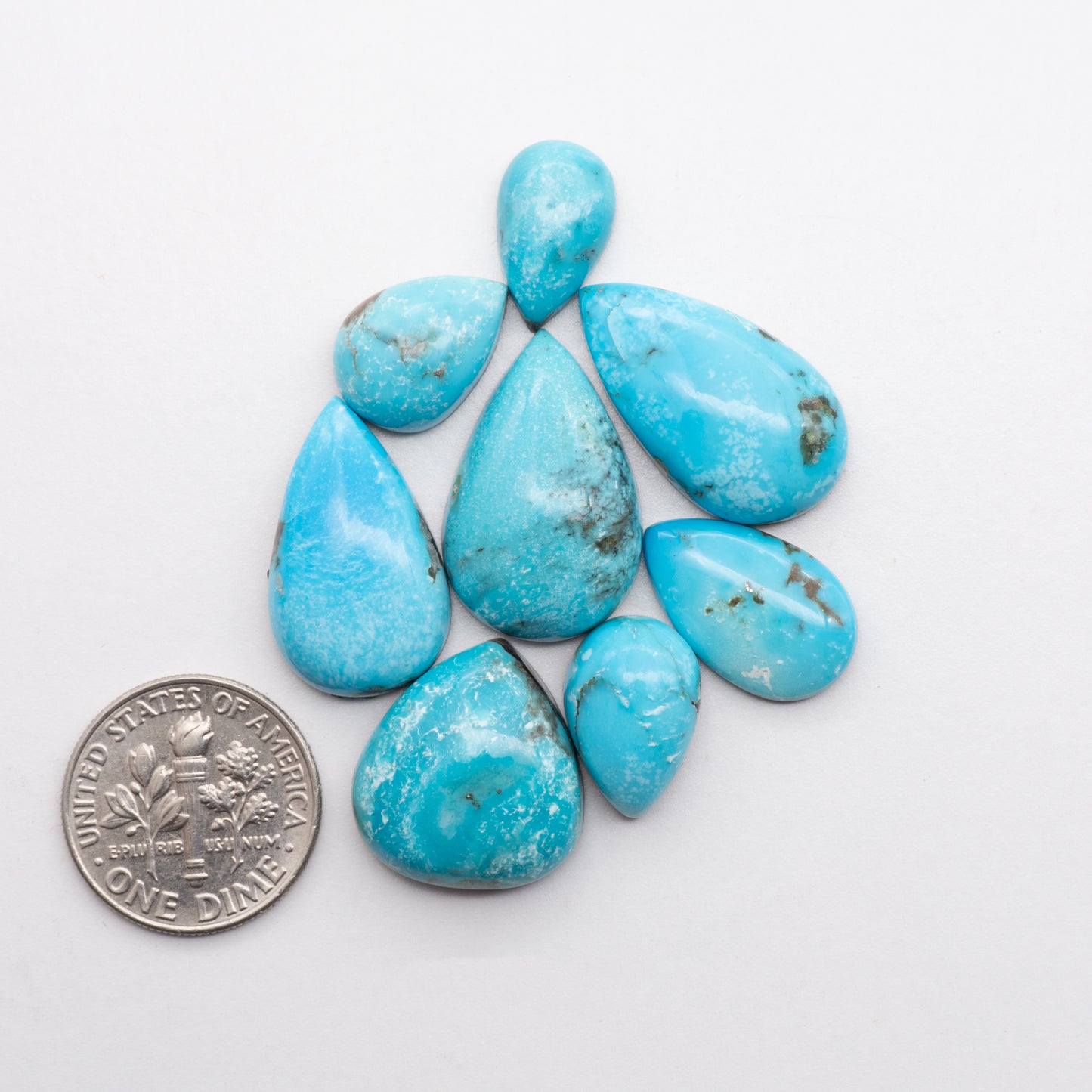 Add unique splashes of color to your jewelry with our Kingman Turquoise. Featuring natural blue hues, these cabochons offer a beautiful contrast to any design. These cabochons are backed for added strength, perfect for necklaces, earrings, and more!