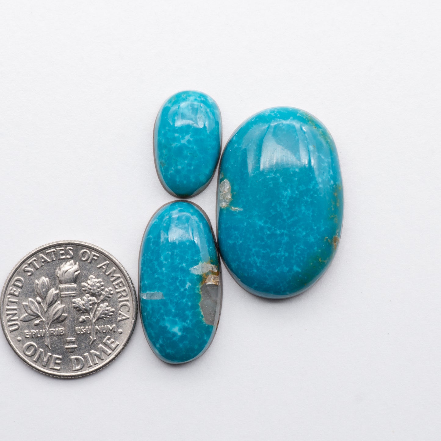 Cumpas Turquoise cabochons have a glossy finish and are backed for added strength. Cumpas Turquoise is mined in Sonora, Mexico.