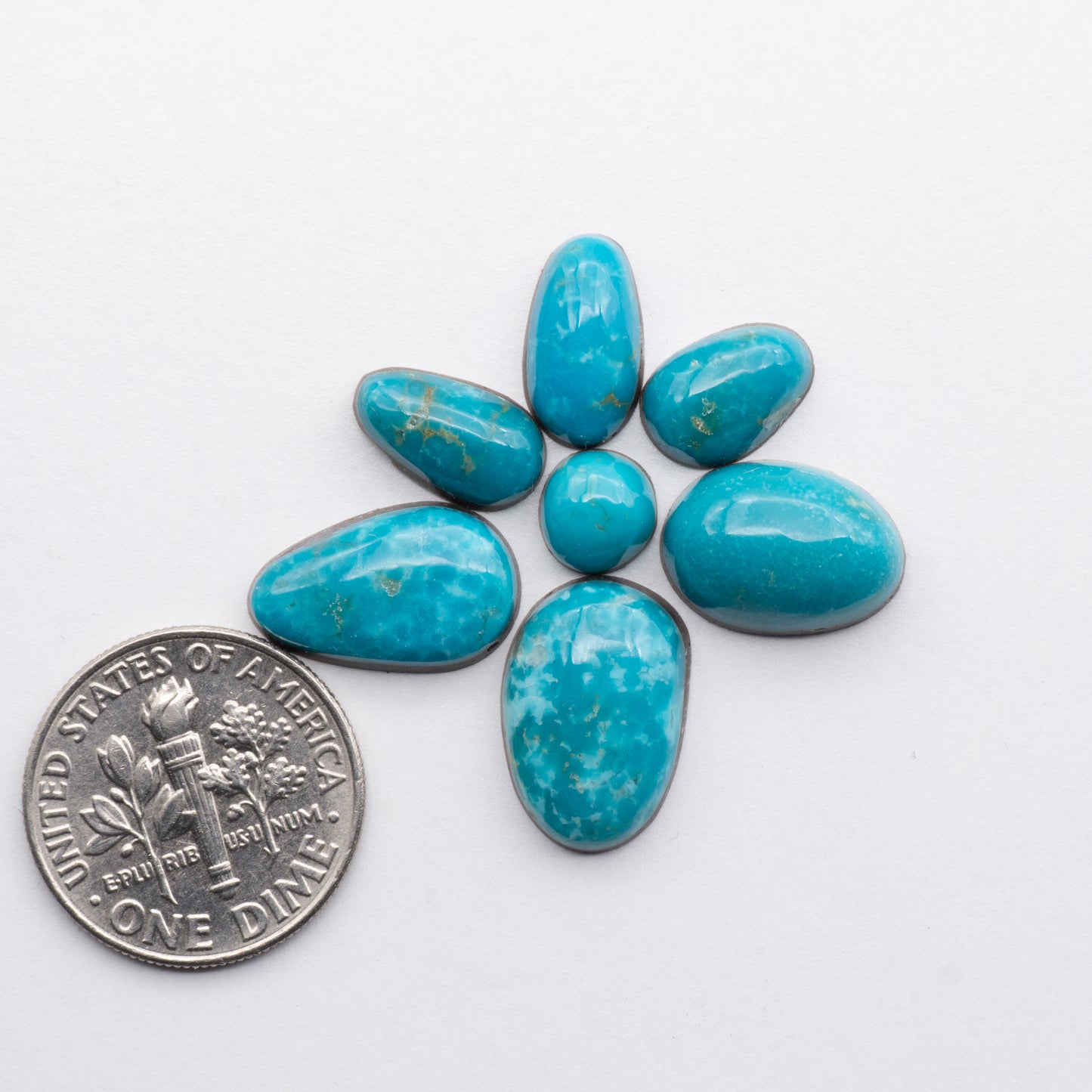 Cumpas Turquoise cabochons have a glossy finish and are backed for added strength. Cumpas Turquoise is mined in Sonora, Mexico.