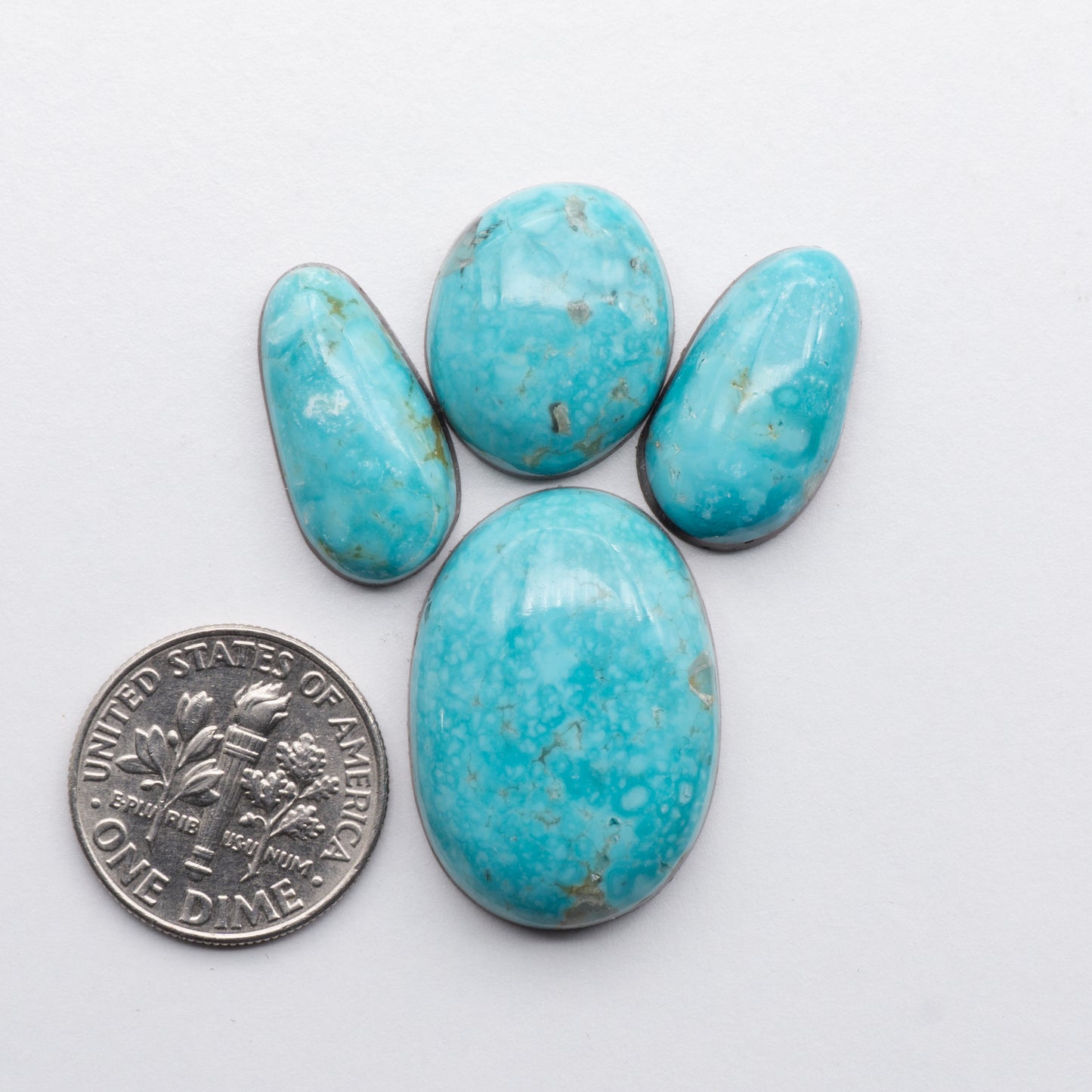 Cumpas Turquoise cabochons have a glossy finish and are backed for added strength. Cumpas Turquoise is mined in Sonora, Mexico.