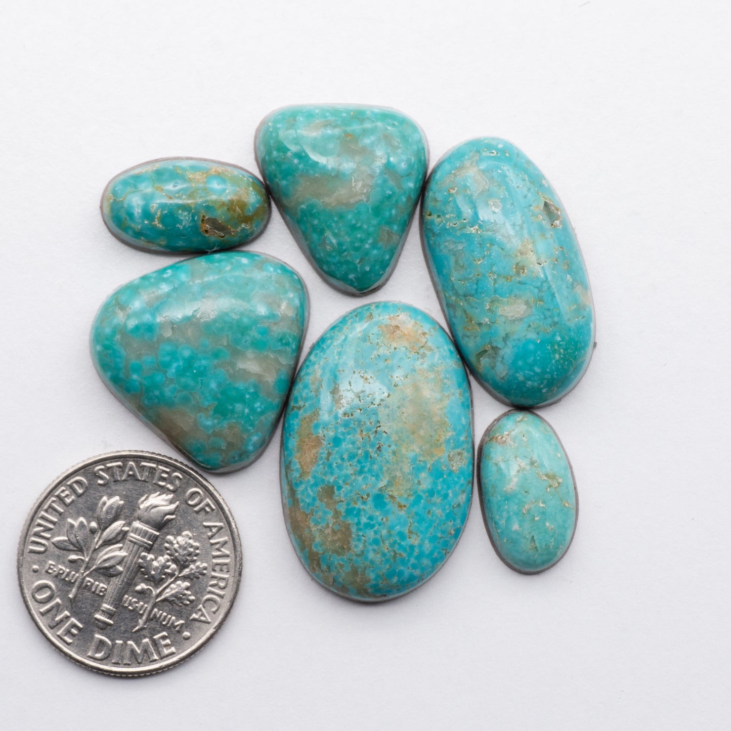 Cumpas Turquoise cabochons have a glossy finish and are backed for added strength. Cumpas Turquoise is mined in Sonora, Mexico.