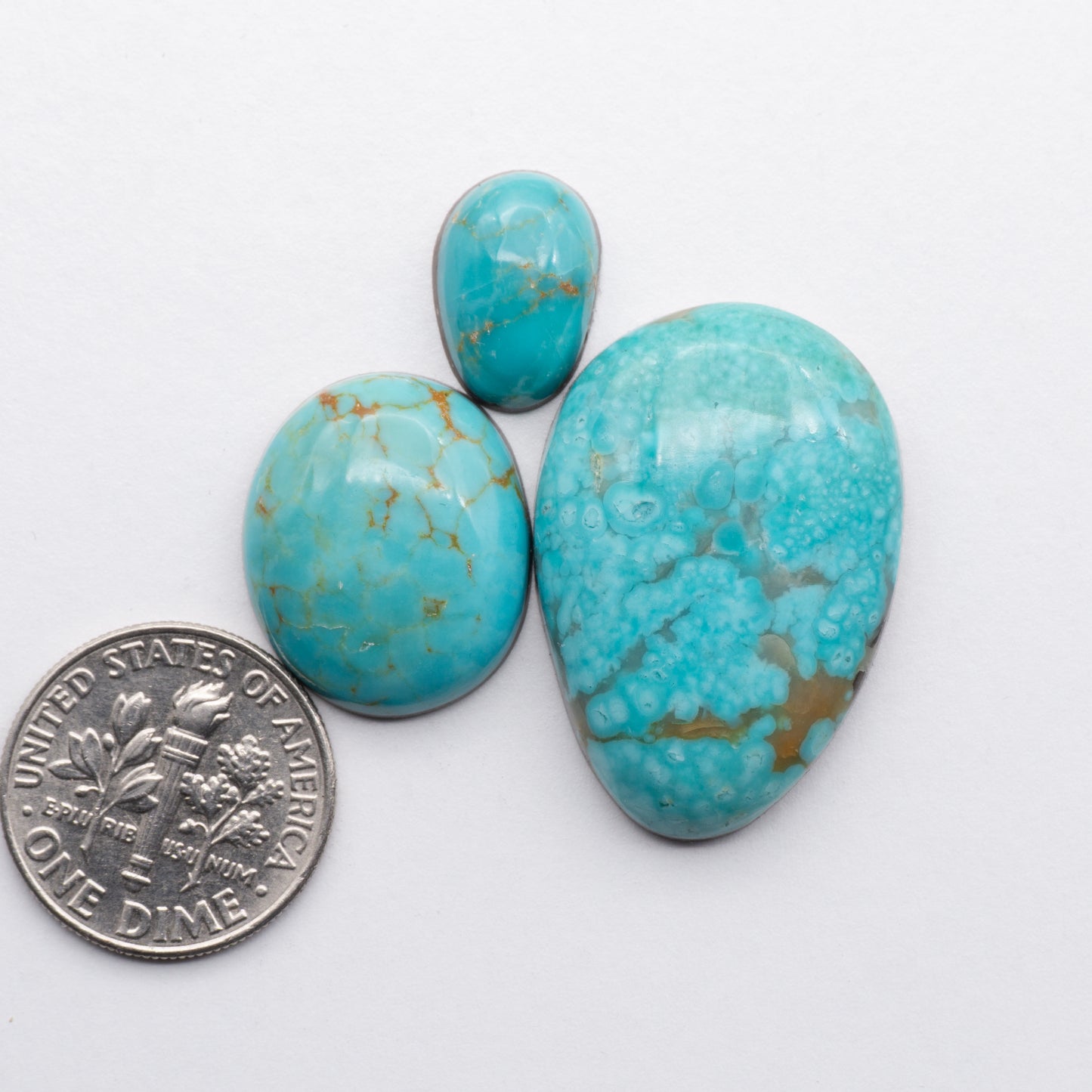 Cumpas Turquoise cabochons have a glossy finish and are backed for added strength. Cumpas Turquoise is mined in Sonora, Mexico.