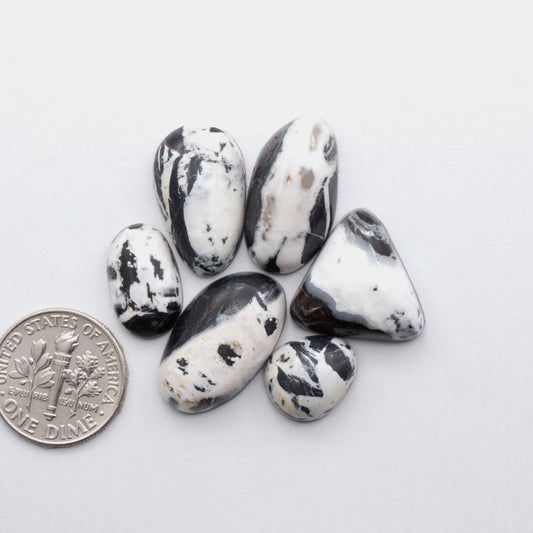 This Natural White Buffalo Stone Cabochon ia a semi-precious gemstone cut into a shape ideal for jewelry-making 