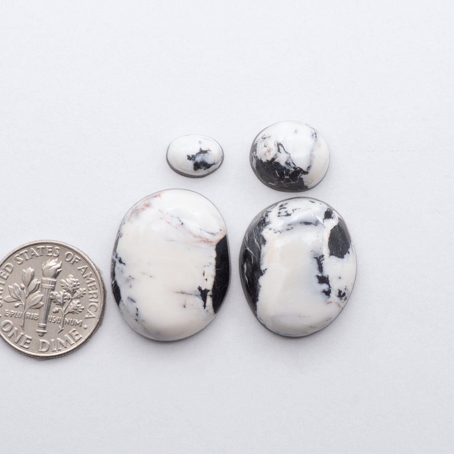These Natural White Buffalo Stone Cabochons are semi-precious gemstones cut into shapes ideal for jewelry-making and crafting and are backed for added strength.