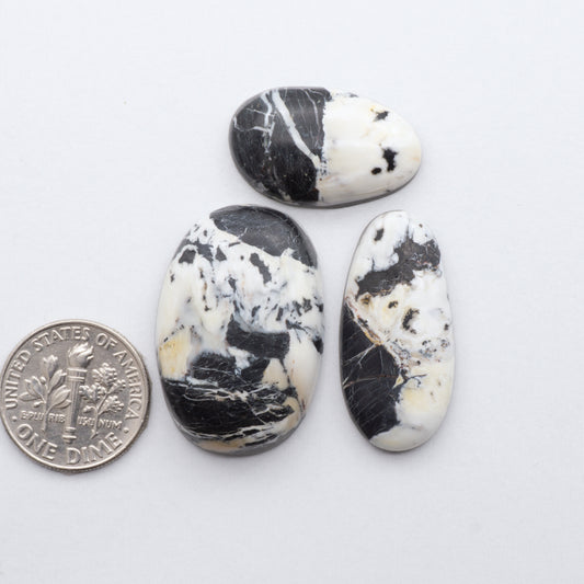 These Natural White Buffalo Stone Cabochons are semi-precious gemstones cut into shapes ideal for jewelry-making