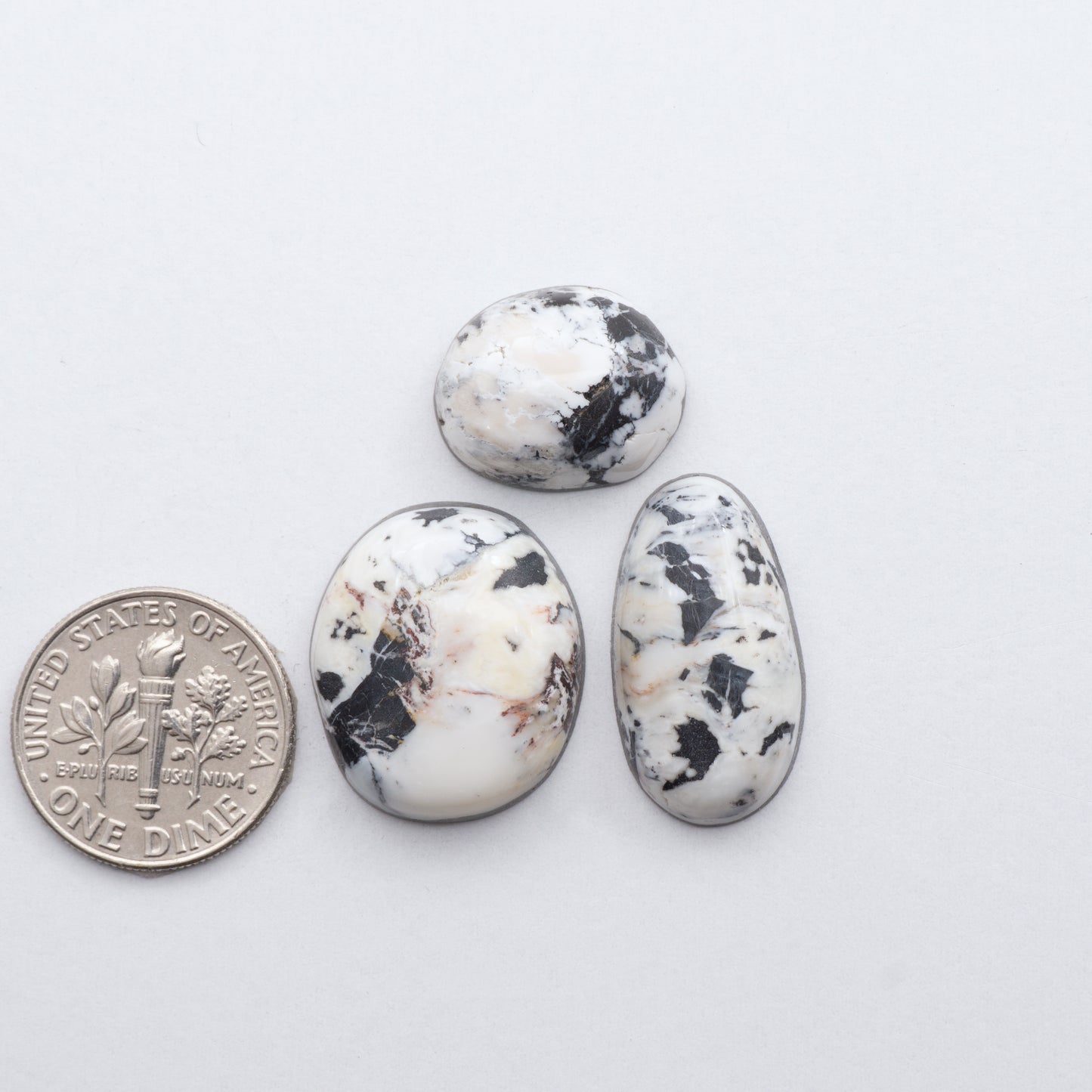 These Natural White Buffalo Stone Cabochons are semi-precious gemstones cut into shapes ideal for jewelry-making and crafting and are backed for added strength.