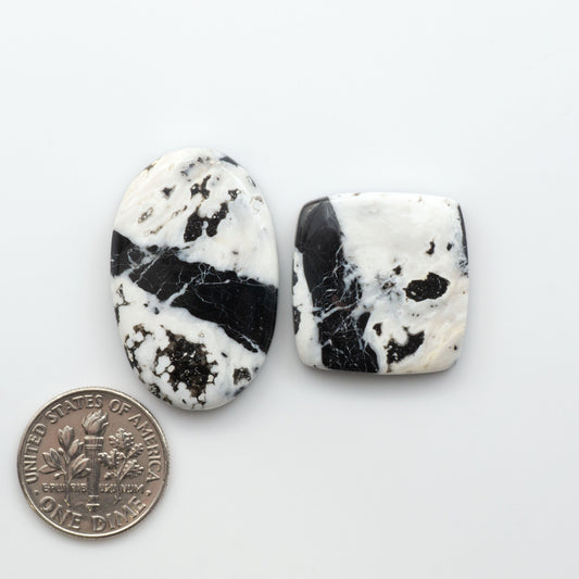 Natural White Buffalo Stone Cabochons are semi-precious gemstones cut into shapes ideal for jewelry-making, making them an excellent choice for artisans.