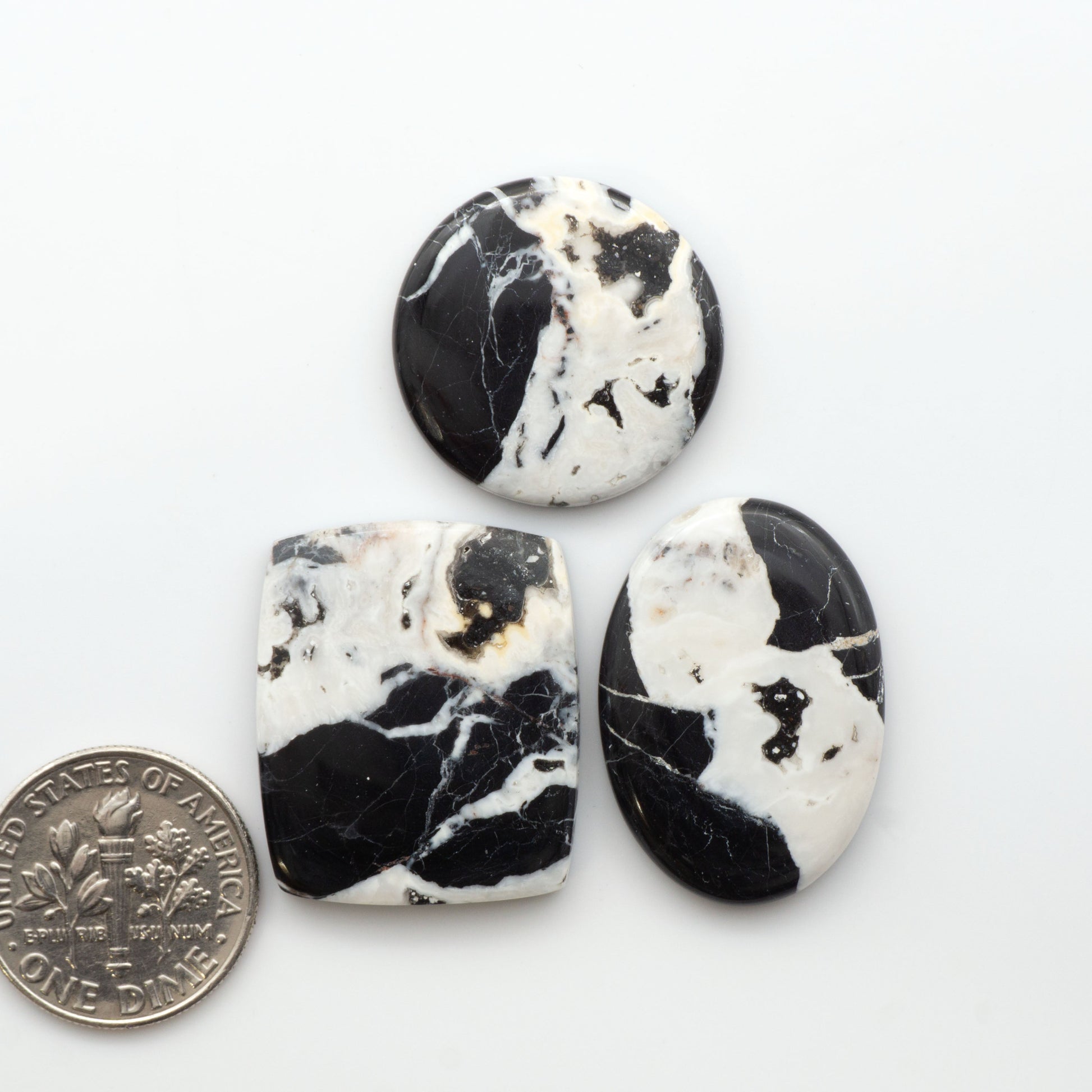 Natural White Buffalo Stone Cabochons are semi-precious gemstones cut into shapes ideal for jewelry-making, making them an excellent choice for artisans.