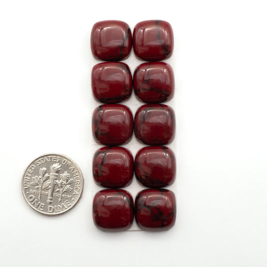 Bloody Bison Jasper is a composite stone with a vibrant red hue and black matrix that creates a strong impression and a touch of opulence to any jewelry piece.