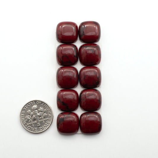 Bloody Bison Jasper is a composite stone with a vibrant red hue and black matrix that creates a strong impression and a touch of opulence to any jewelry piece.