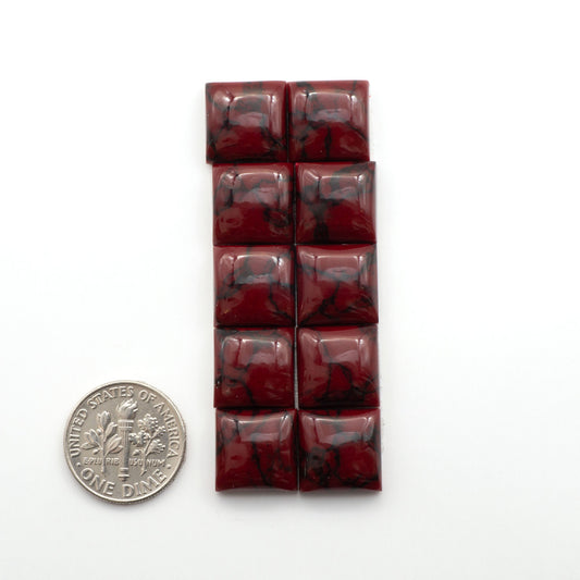 Bloody Bison Jasper is a composite stone with a vibrant red hue and black matrix that creates a strong impression and a touch of opulence to any jewelry piece.