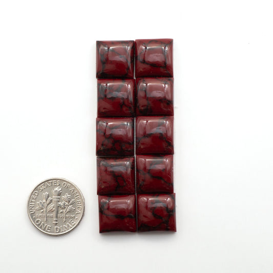 Bloody Bison Jasper is a composite stone with a vibrant red hue and black matrix that creates a strong impression and a touch of opulence to any jewelry piece.