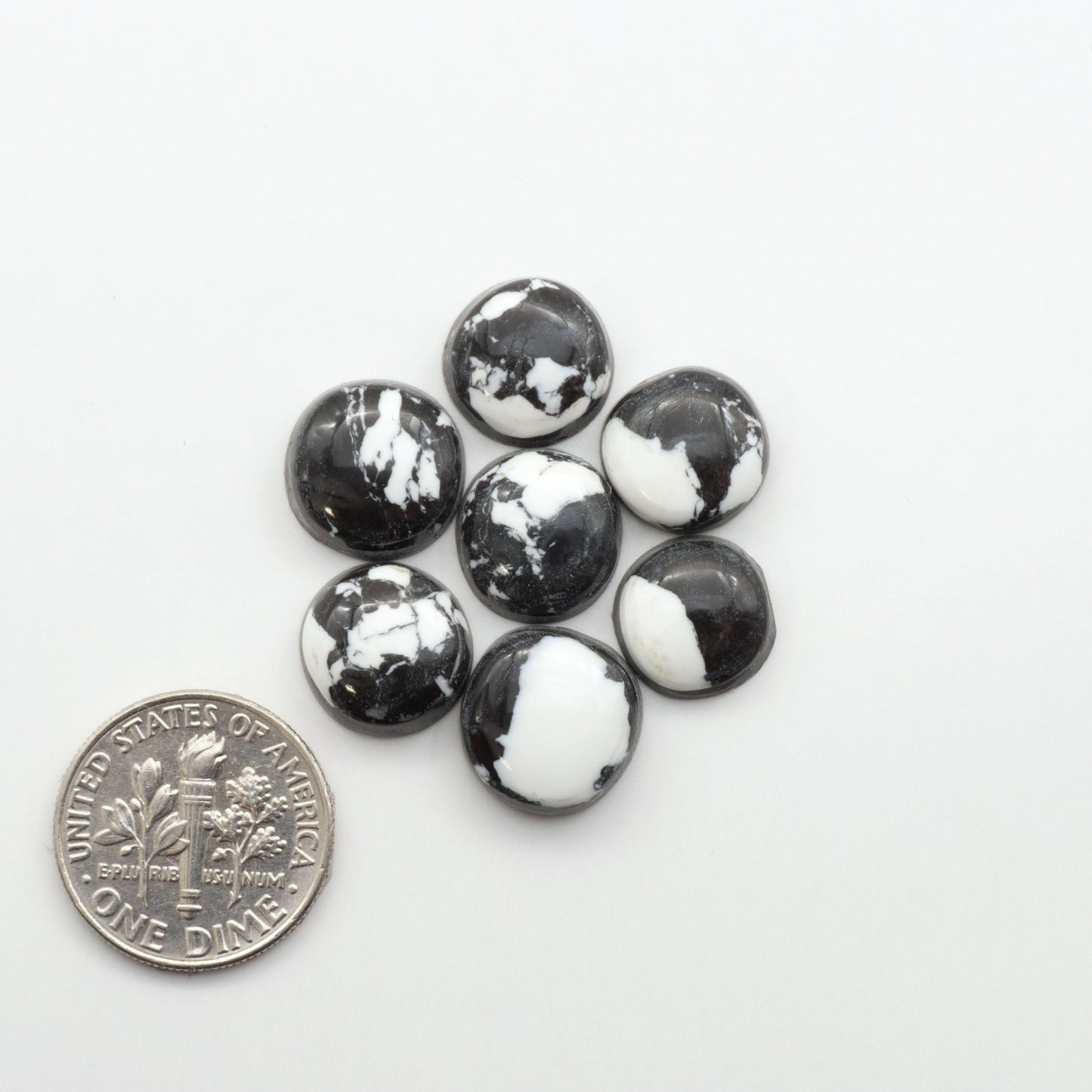 These White Buffalo Cabochons are expertly cut and polished from composite material, resulting in a stunning and long-lasting gemstone.