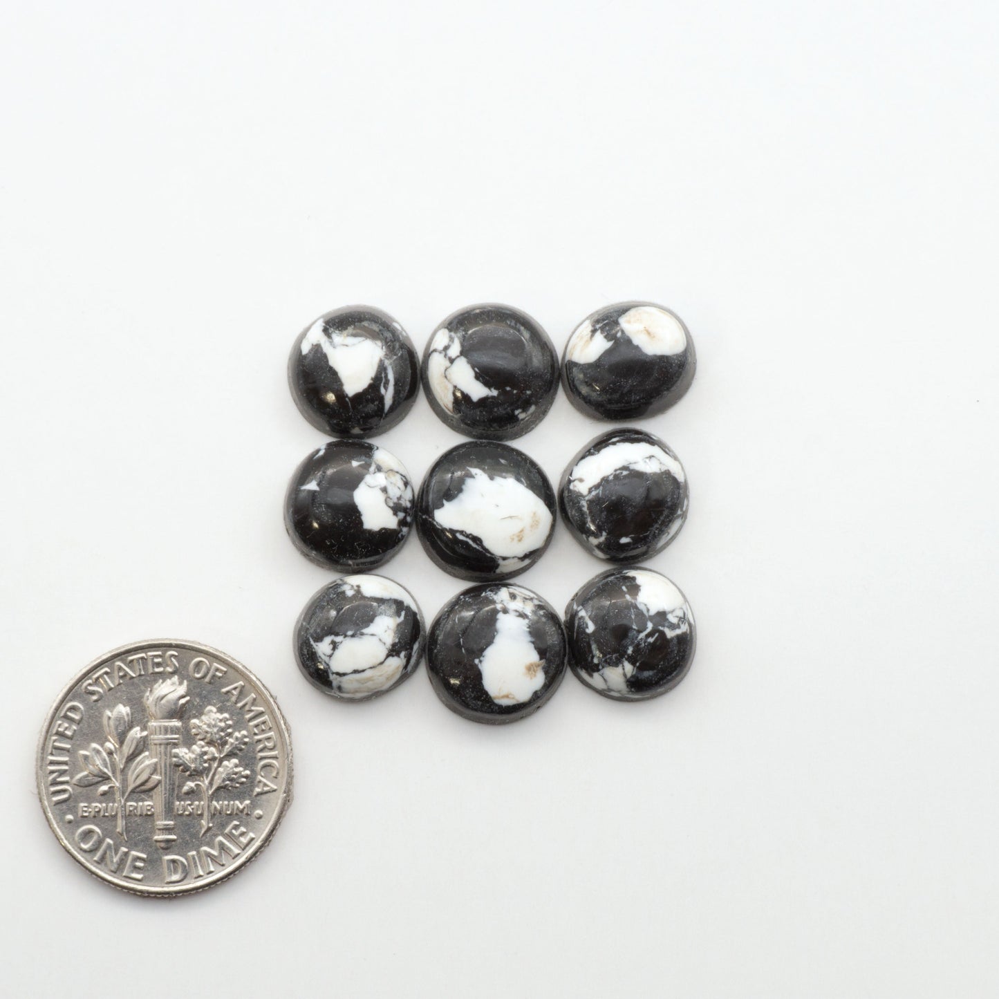 These White Buffalo Cabochons are expertly cut and polished from composite material, resulting in a stunning and long-lasting gemstone.