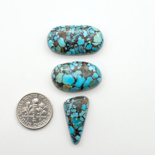 Enhance your jewelry designs with Pressed Turquoise Nugget Cabochons. Crafted from composite materials they add a captivating touch to your creations.