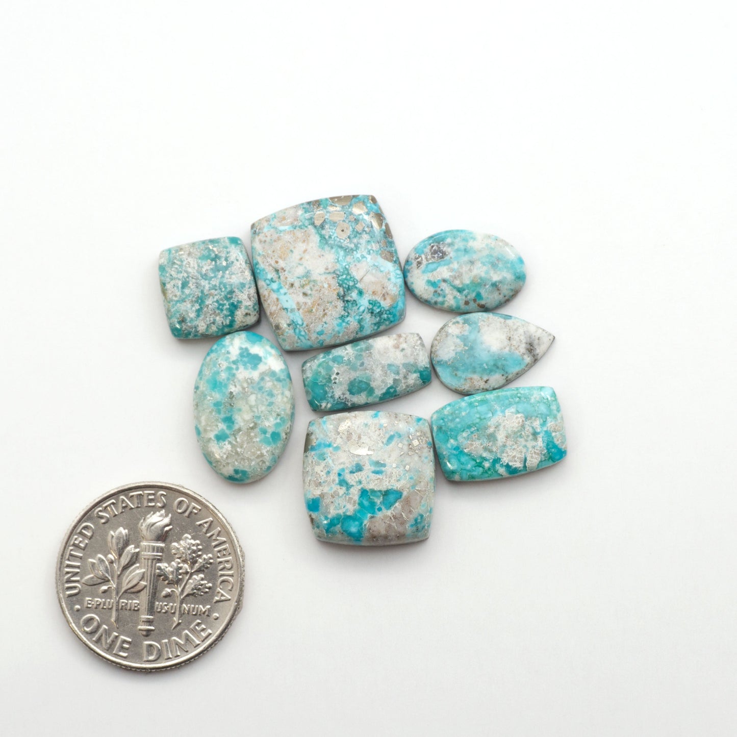 White Water Turquoise Cabochons with their mesmerizing patterns and one-of-a-kind colors, are perfect for those looking for a unique and eye-catching piece.