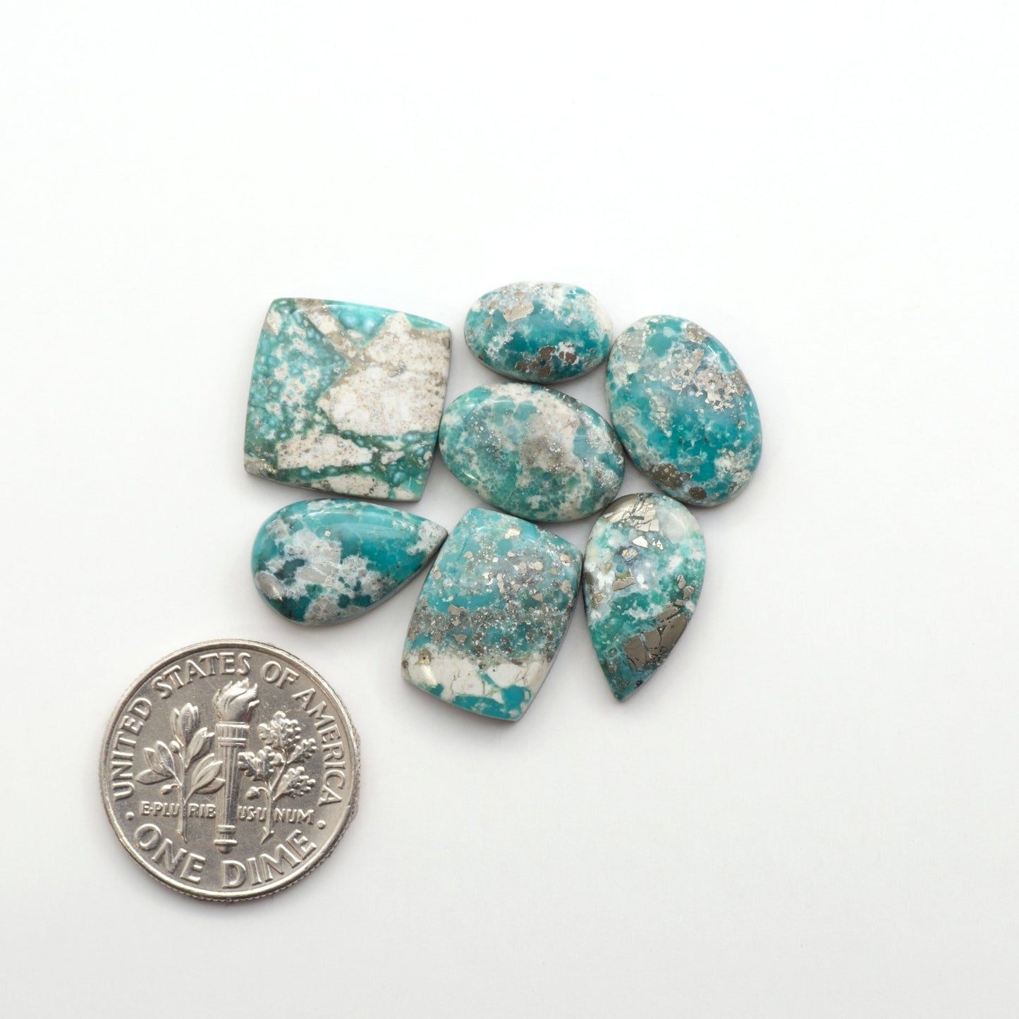 White Water Turquoise Cabochons with their mesmerizing patterns and one-of-a-kind colors, are perfect for those looking for a unique and eye-catching piece.