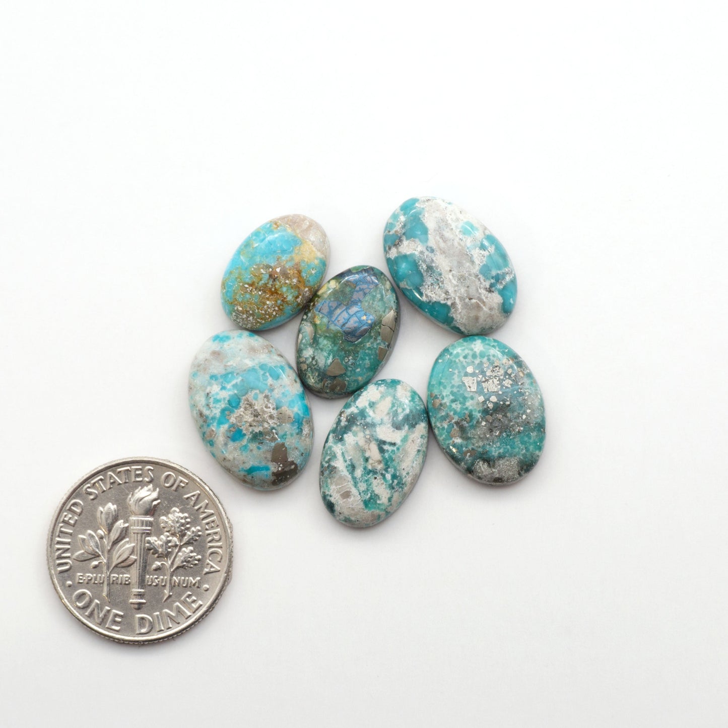 White Water Turquoise Cabochons with their mesmerizing patterns and one-of-a-kind colors, are perfect for those looking for a unique and eye-catching piece.
