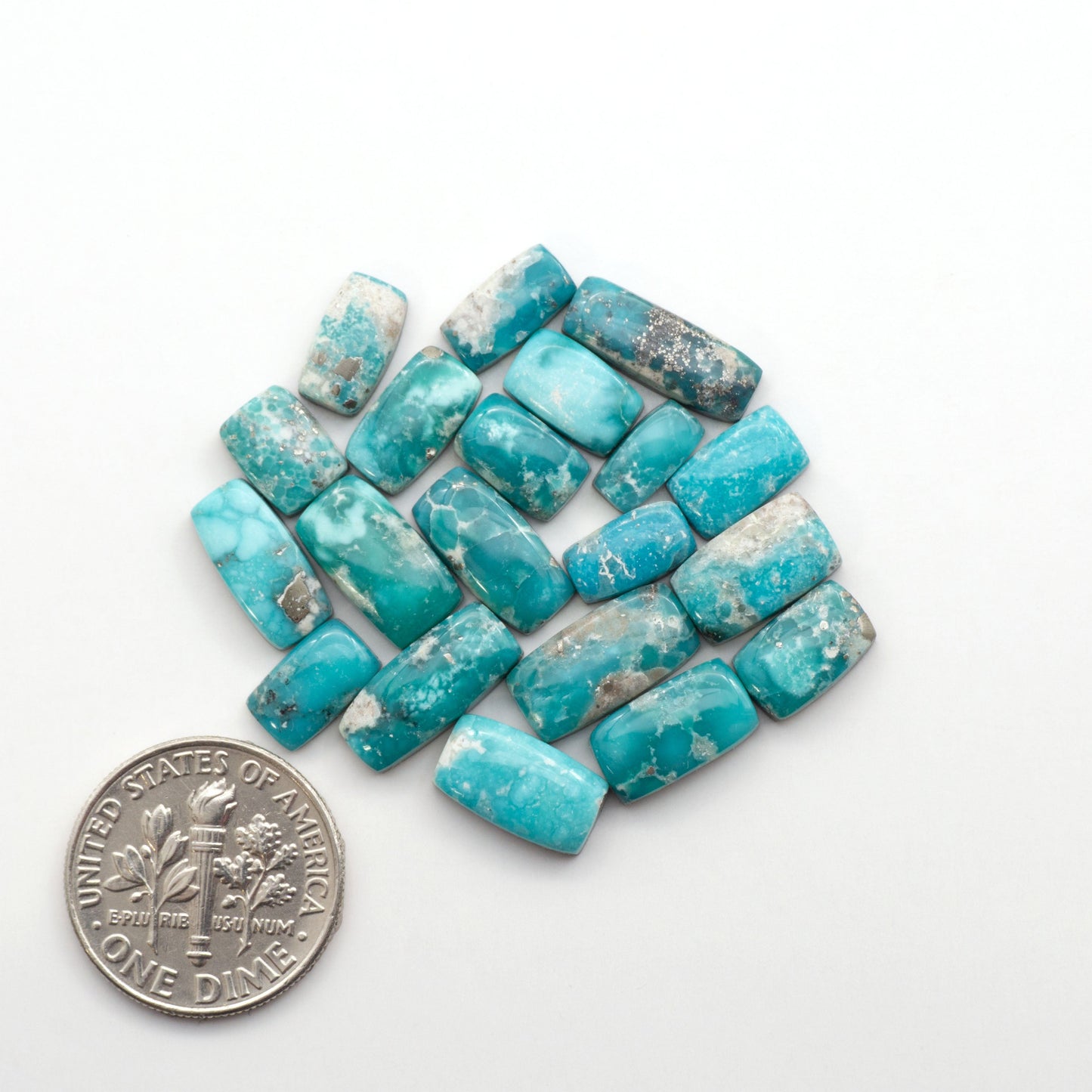 White Water Turquoise Cabochons with their mesmerizing patterns and one-of-a-kind colors, are perfect for those looking for a unique and eye-catching piece.