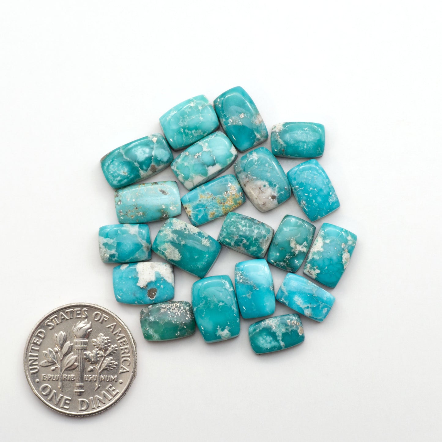 White Water Turquoise Cabochons with their mesmerizing patterns and one-of-a-kind colors, are perfect for those looking for a unique and eye-catching piece.