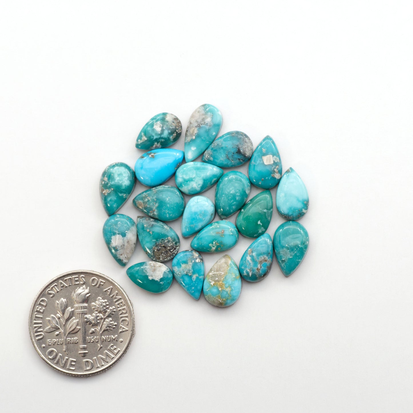 White Water Turquoise Cabochons with their mesmerizing patterns and one-of-a-kind colors, are perfect for those looking for a unique and eye-catching piece.