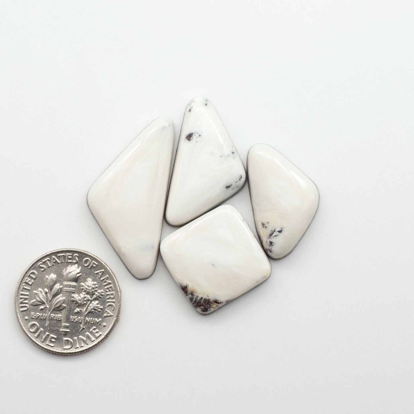 Natural White Buffalo Stone Cabochons are semi-precious gemstones cut into shapes ideal for jewelry-making, making them an excellent choice for artisans.