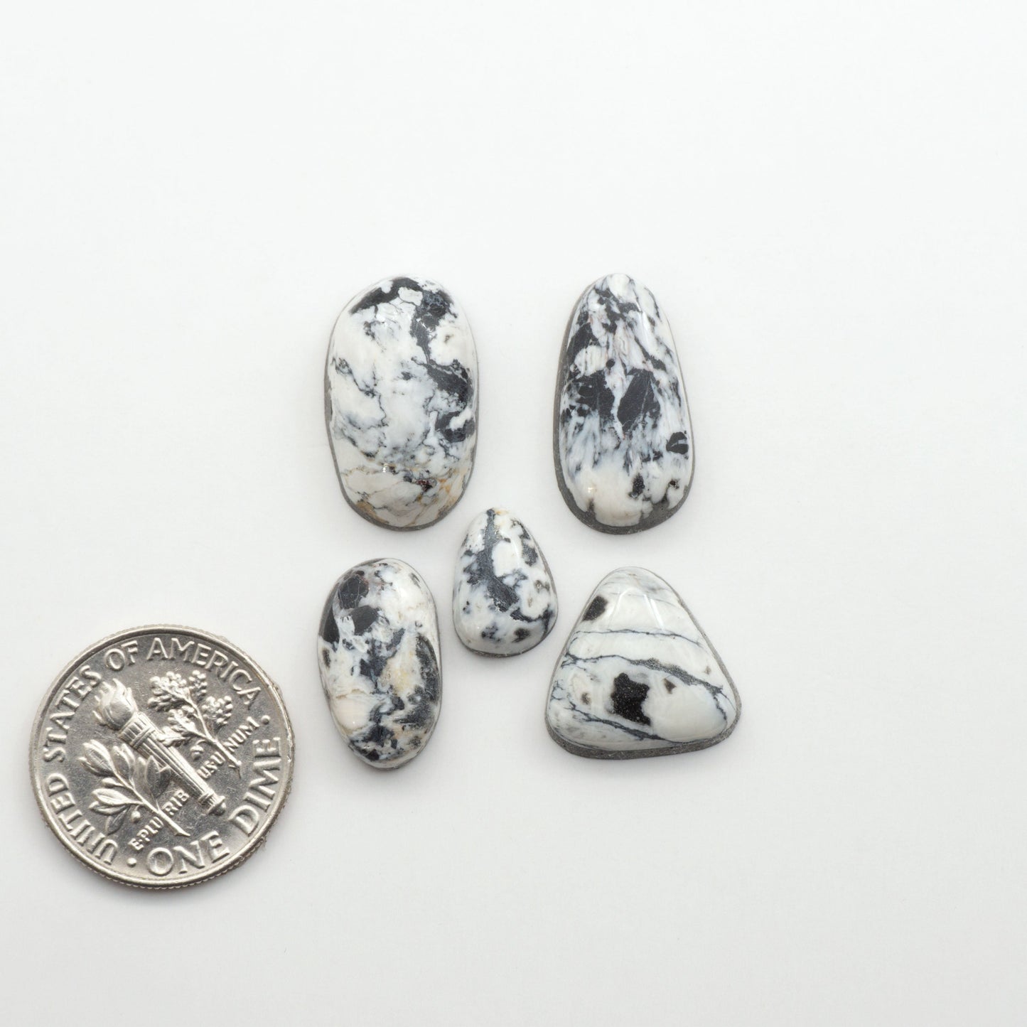 Natural White Buffalo Stone Cabochons are semi-precious gemstones cut into shapes ideal for jewelry-making, making them an excellent choice for artisans.