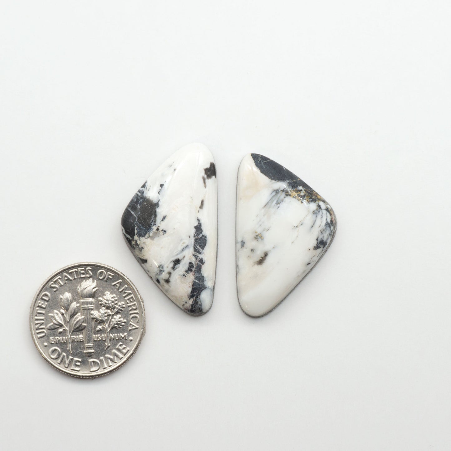 Natural White Buffalo Stone Cabochons are semi-precious gemstones cut into shapes ideal for jewelry-making, making them an excellent choice for artisans.