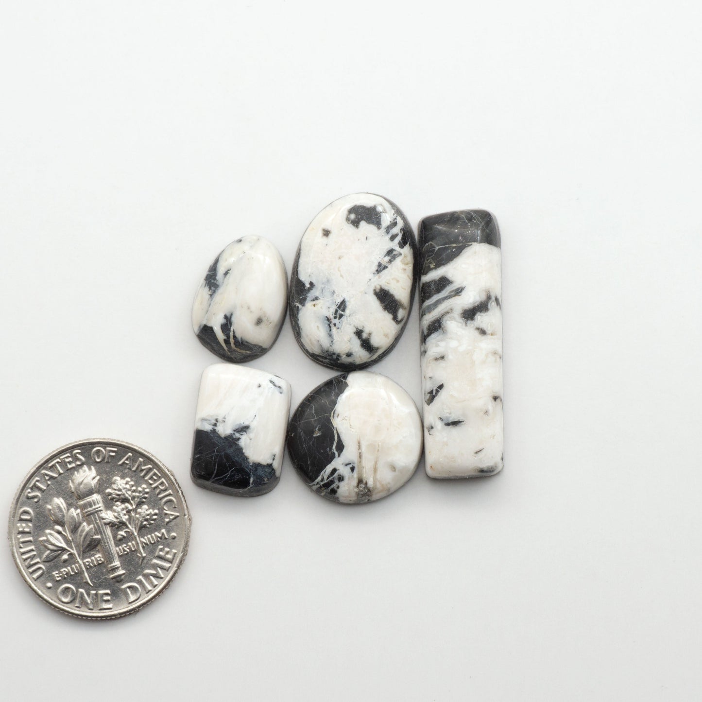 Natural White Buffalo Stone Cabochons are semi-precious gemstones cut into shapes ideal for jewelry-making, making them an excellent choice for artisans.