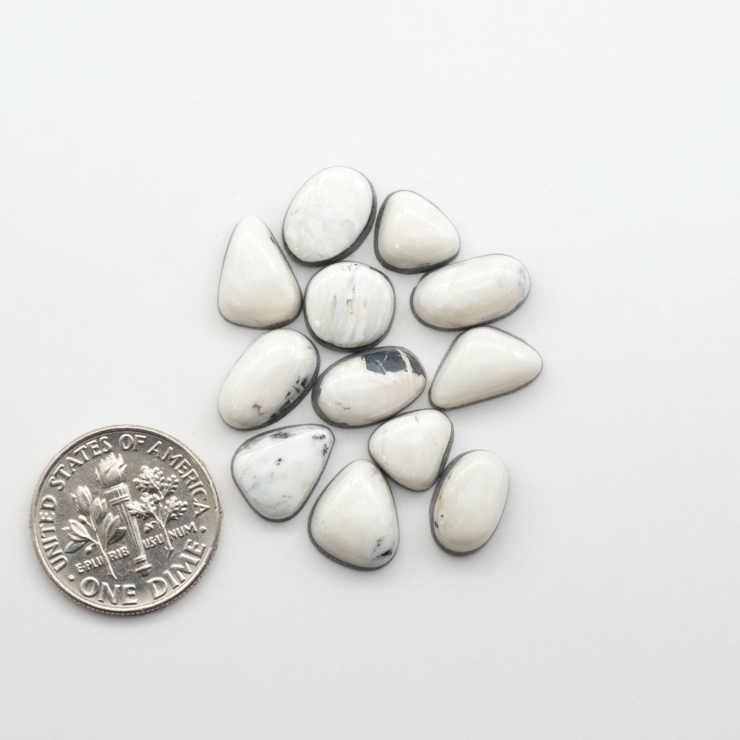 Natural White Buffalo Stone Cabochons are semi-precious gemstones cut into shapes ideal for jewelry-making, making them an excellent choice for artisans.